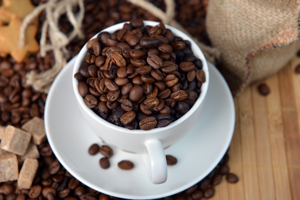 Image of a cup full of coffee beans