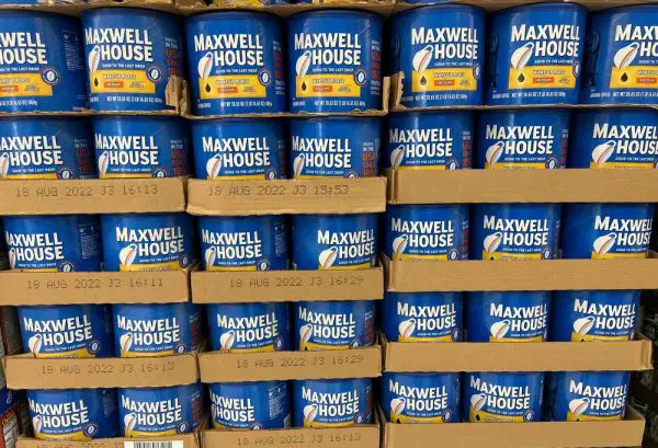 Picture of cans of Maxwell Coffee on Supermarket Shelves